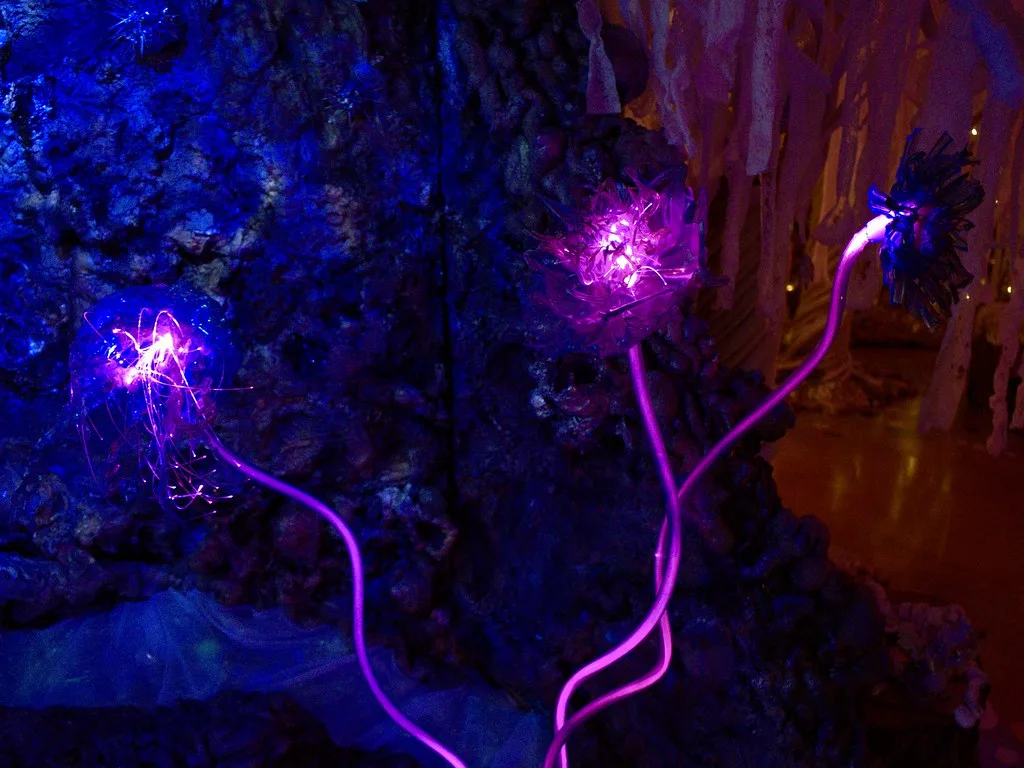 Futuristic Bioluminescent Art Installation with Glowing Fiber Optic Flowers