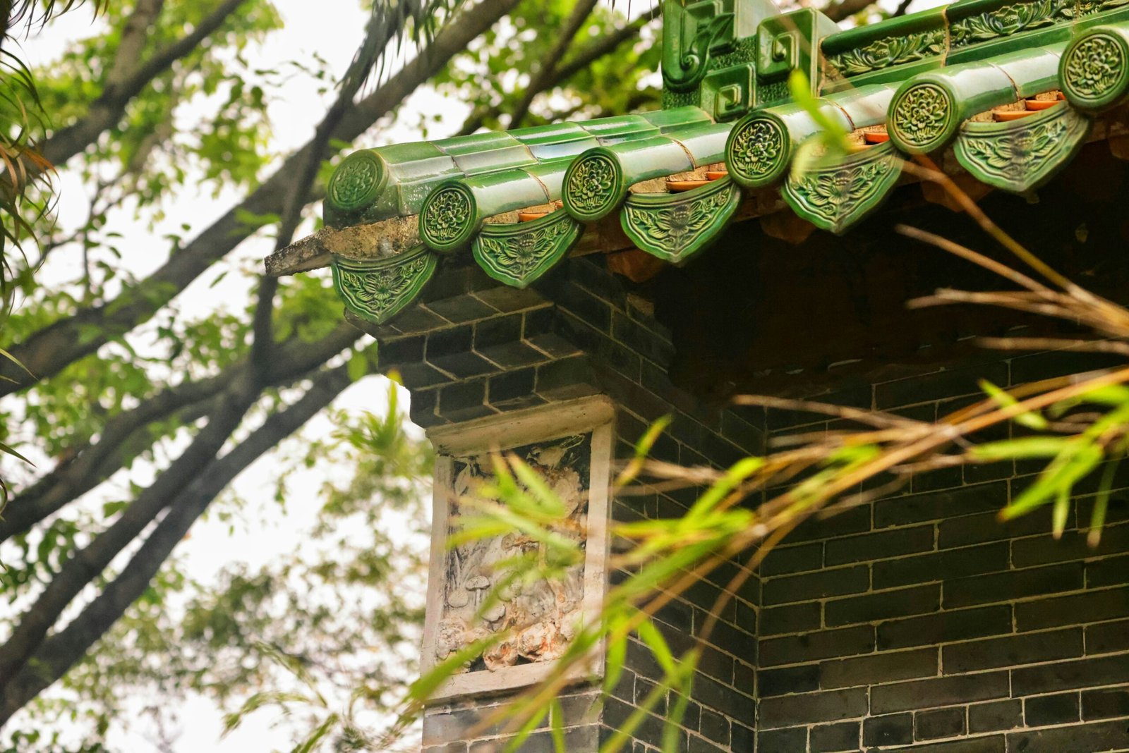 a close up of a building with a green roof