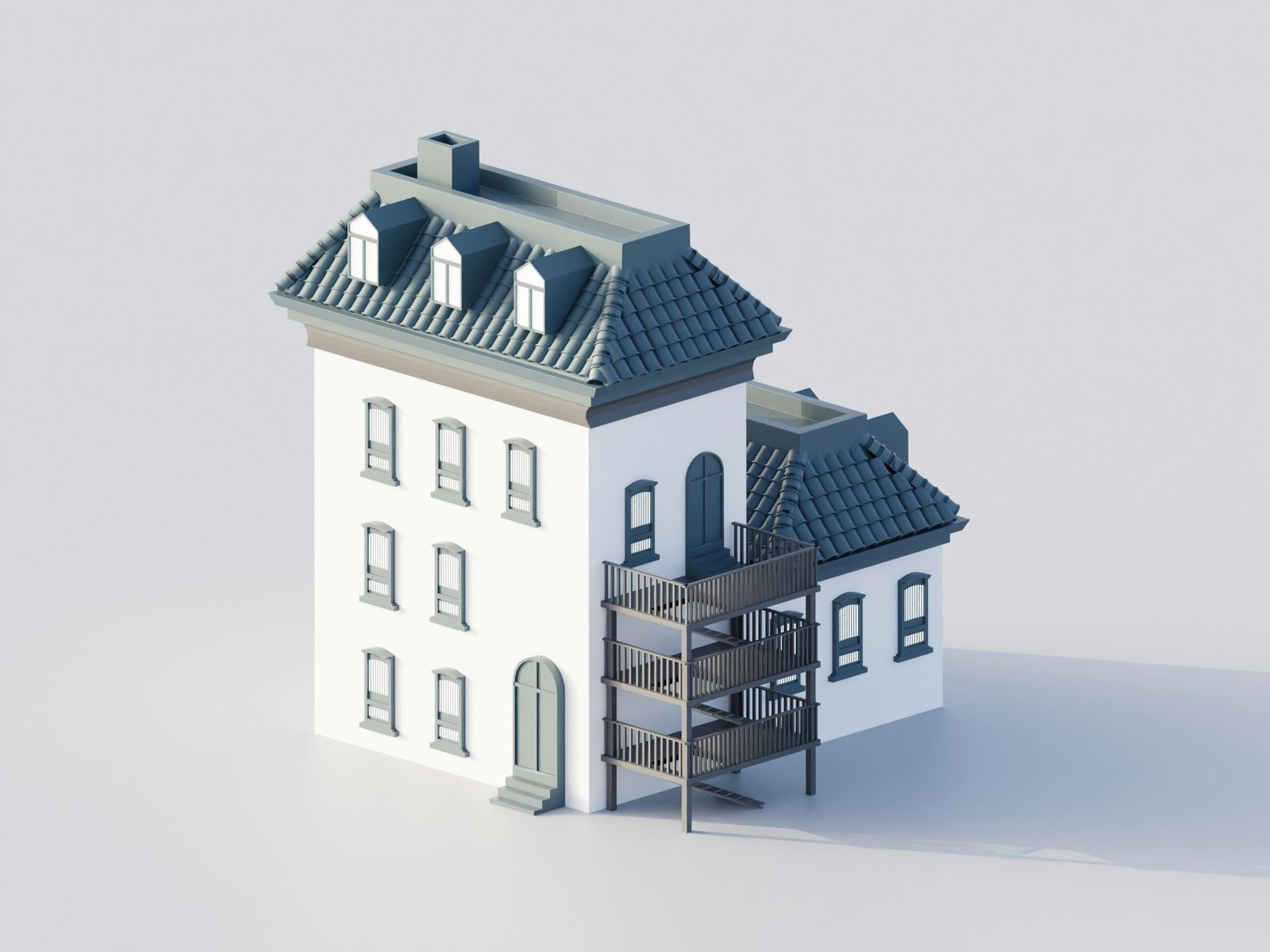 A white building with a dark roof and balconies.