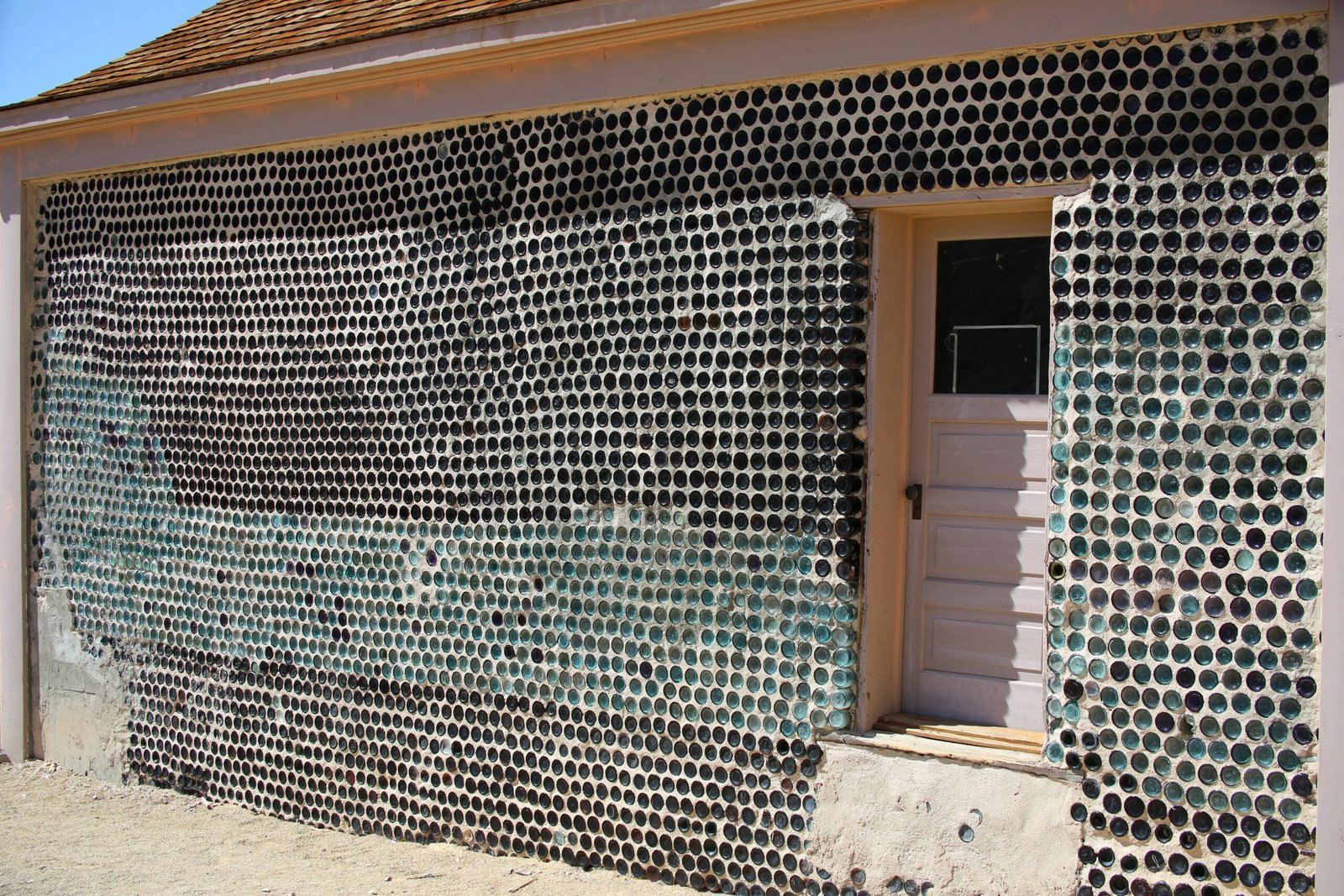 a building with a lot of bottles on the side of it