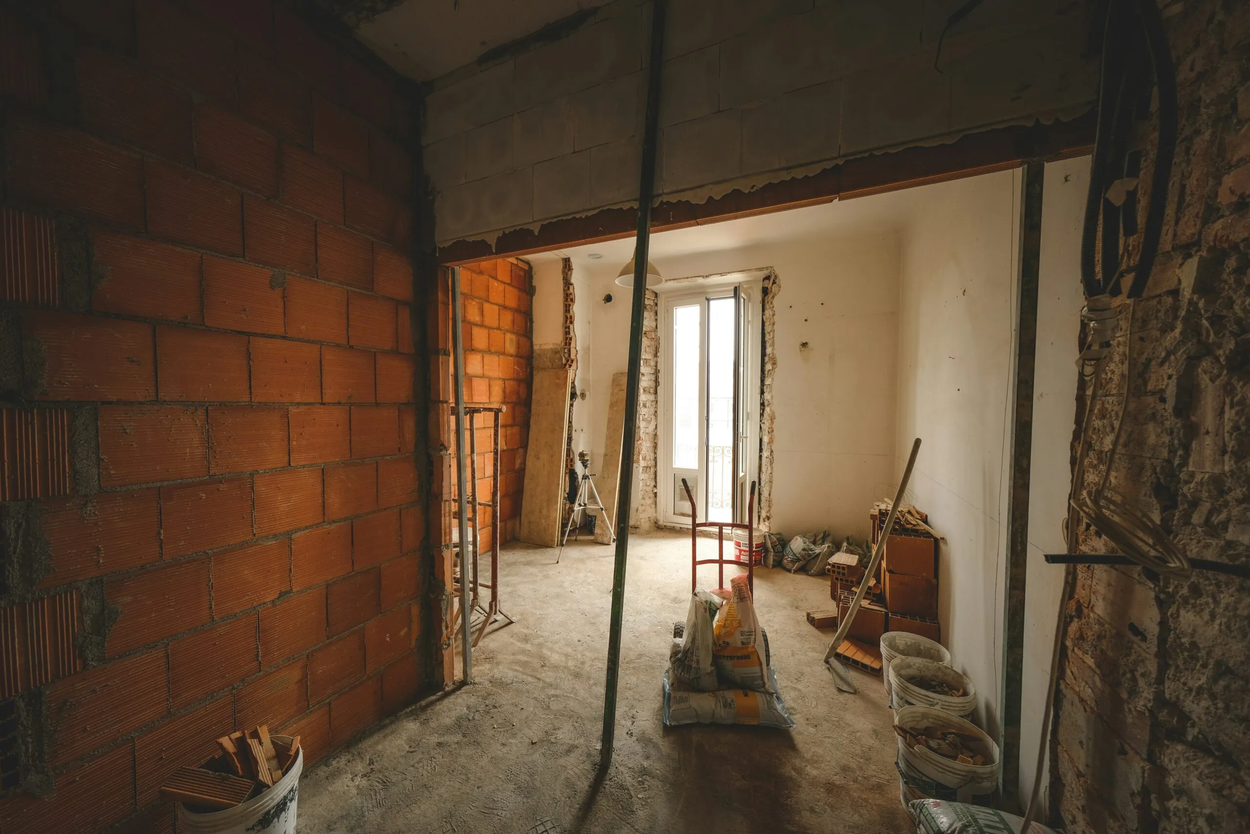 a room with a brick wall and a doorway