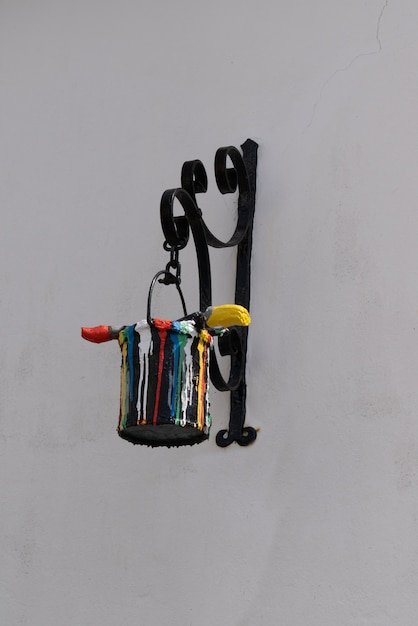 Bucket of paint and paintbrush shop sign professional painter