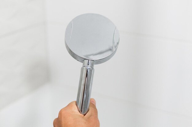 Cropped hand holding dental equipment