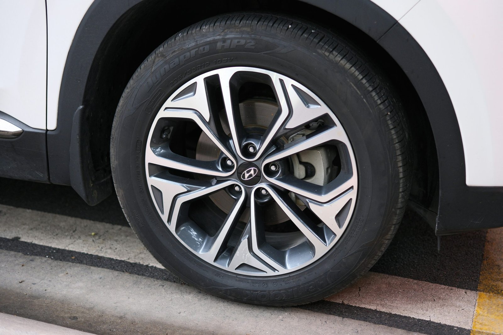 A car's wheel with stylish rims.