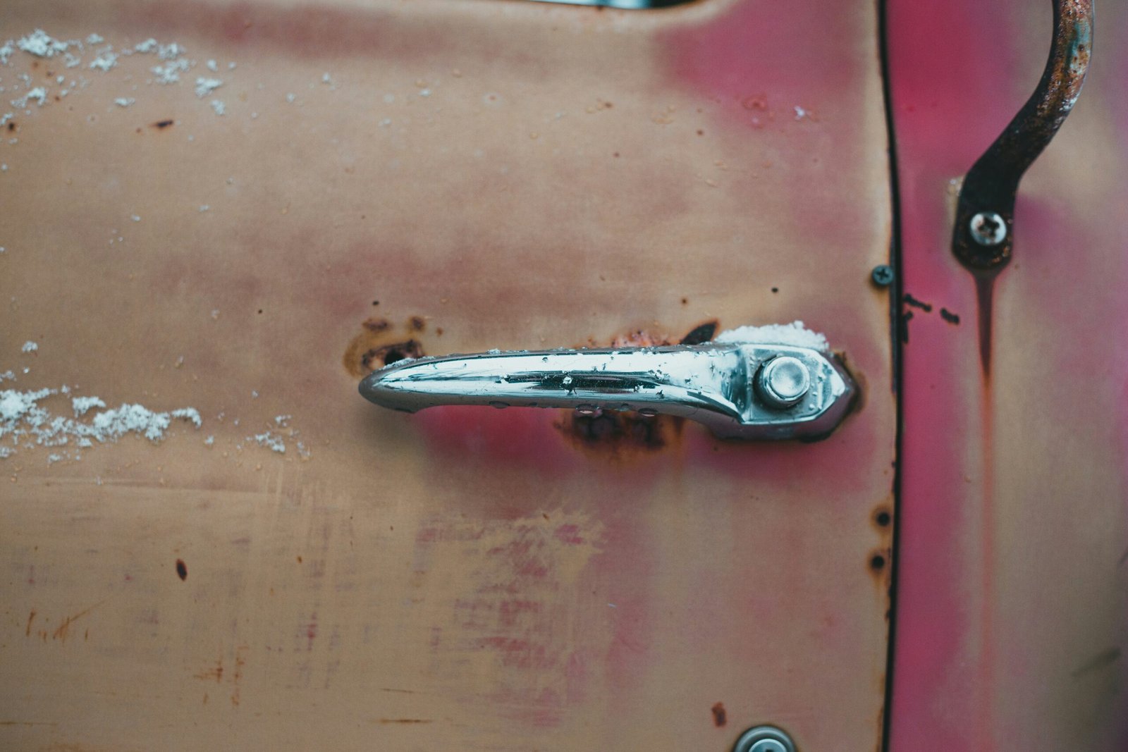 stainless steel nail cutter on red table