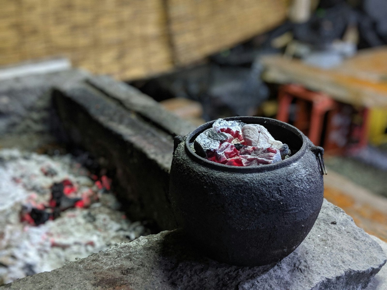 black ceramic round bowl on gray concrete surface