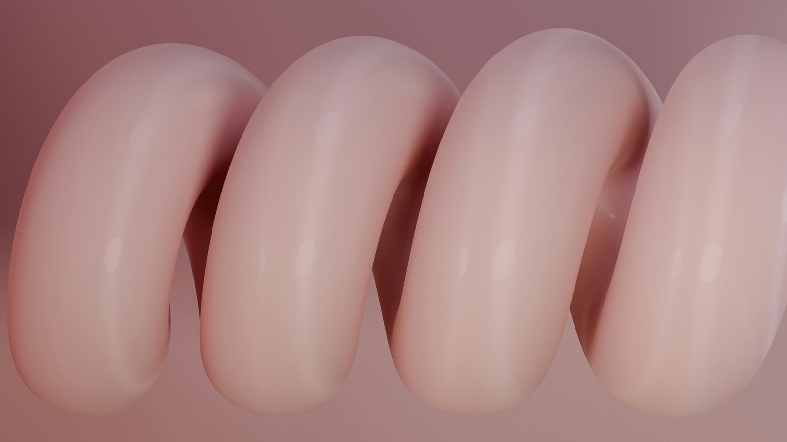 a row of three pink fake breast breasts