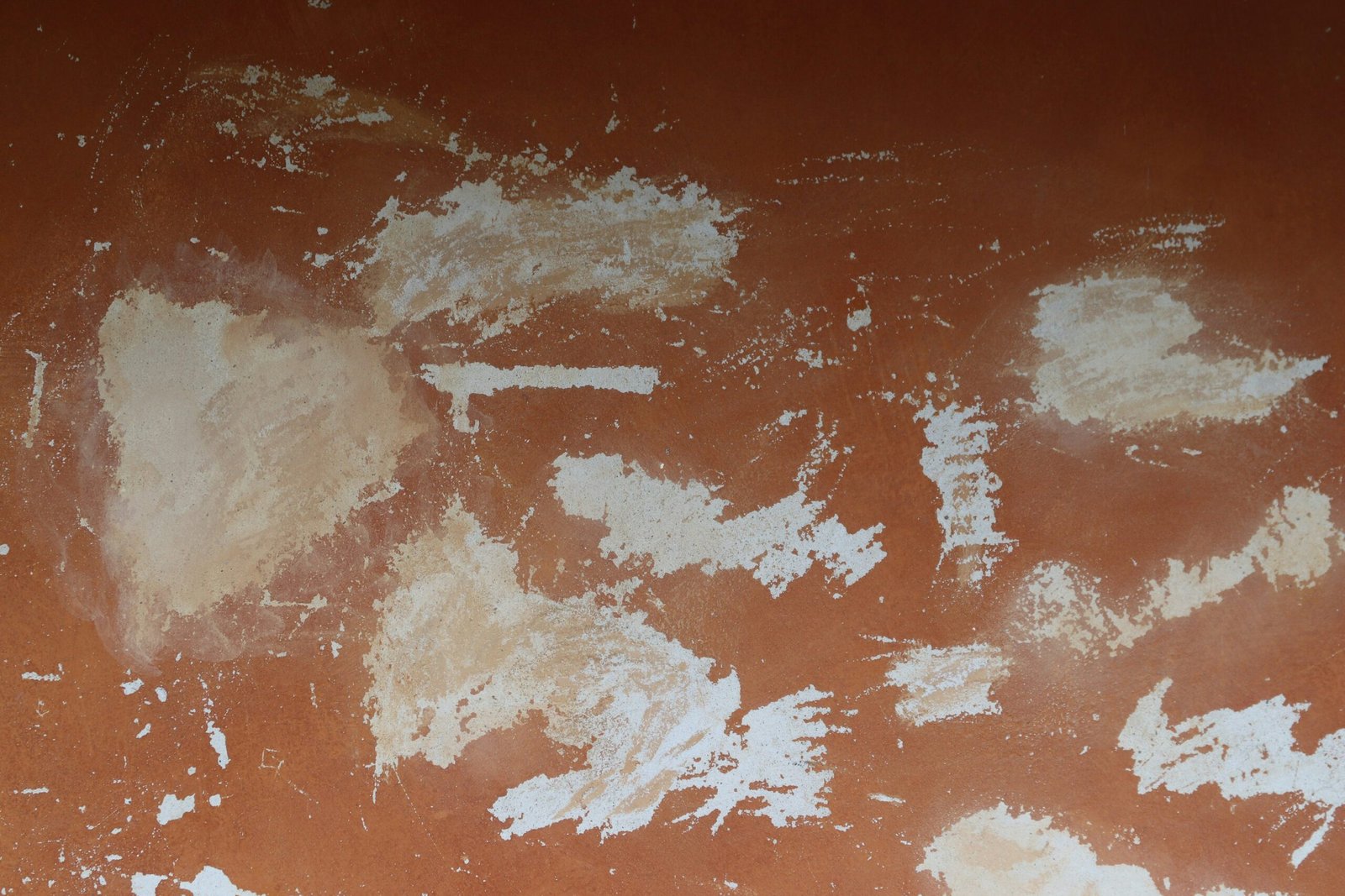White patches on an orange wall.