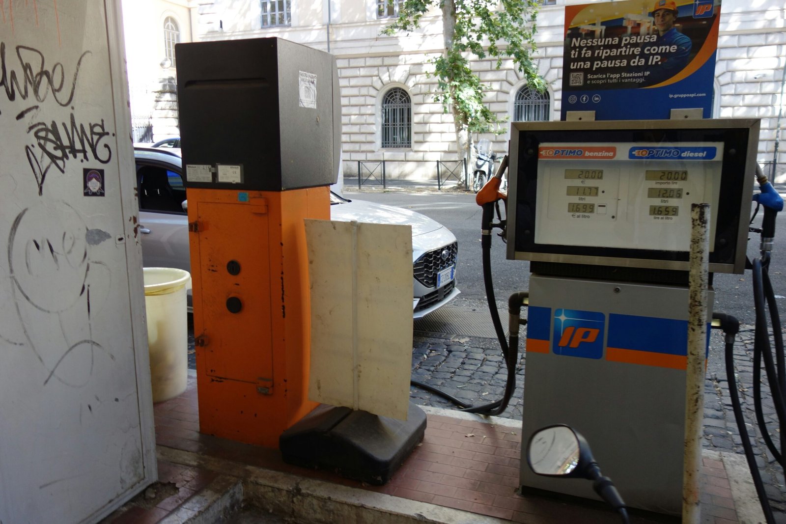 Gas pumps at a station with digital displays.