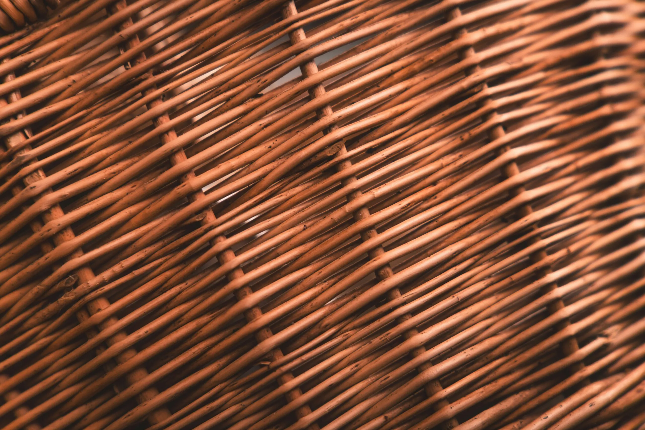 A close up of a brown wicker basket