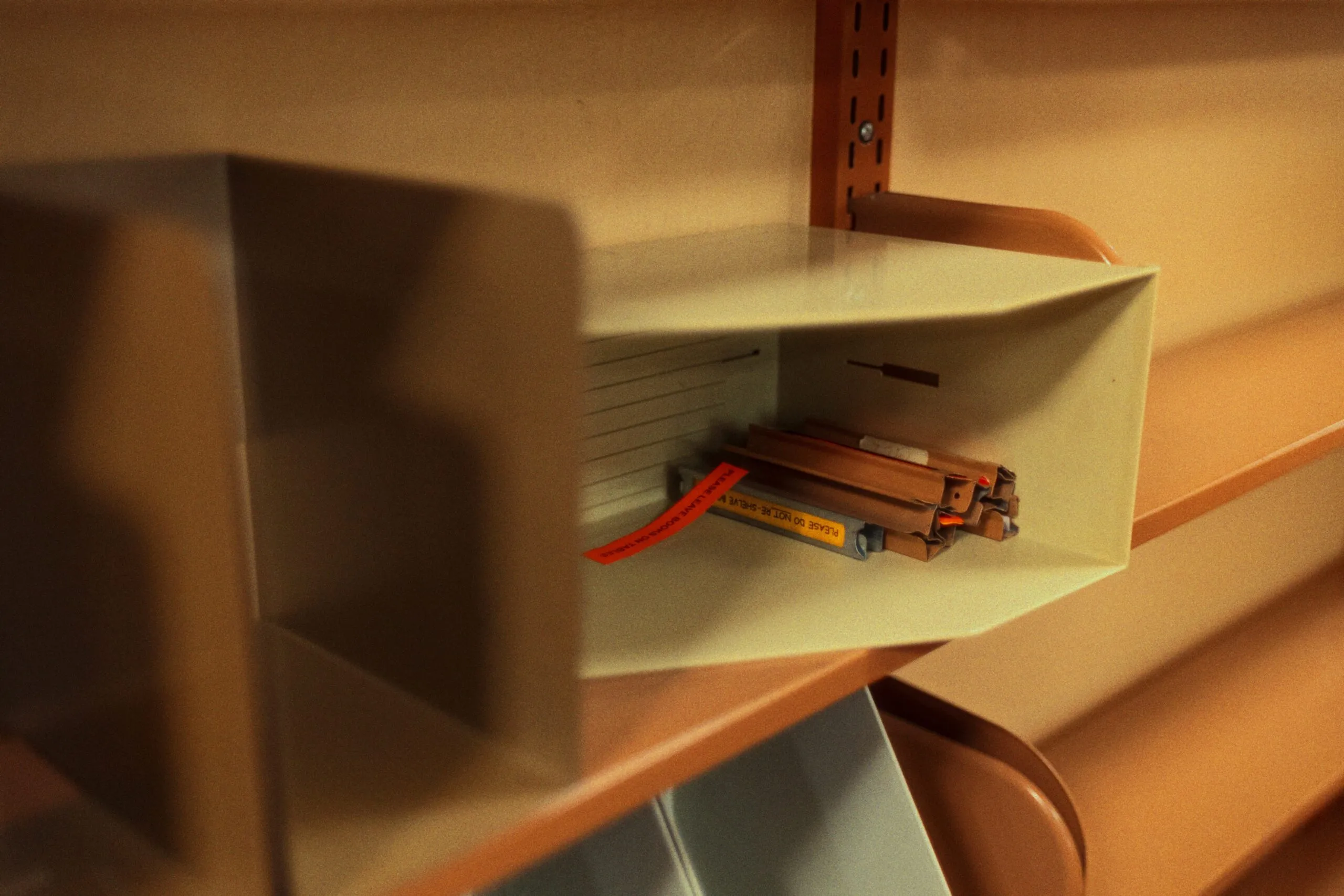 A close up of a shelf with a clock on it