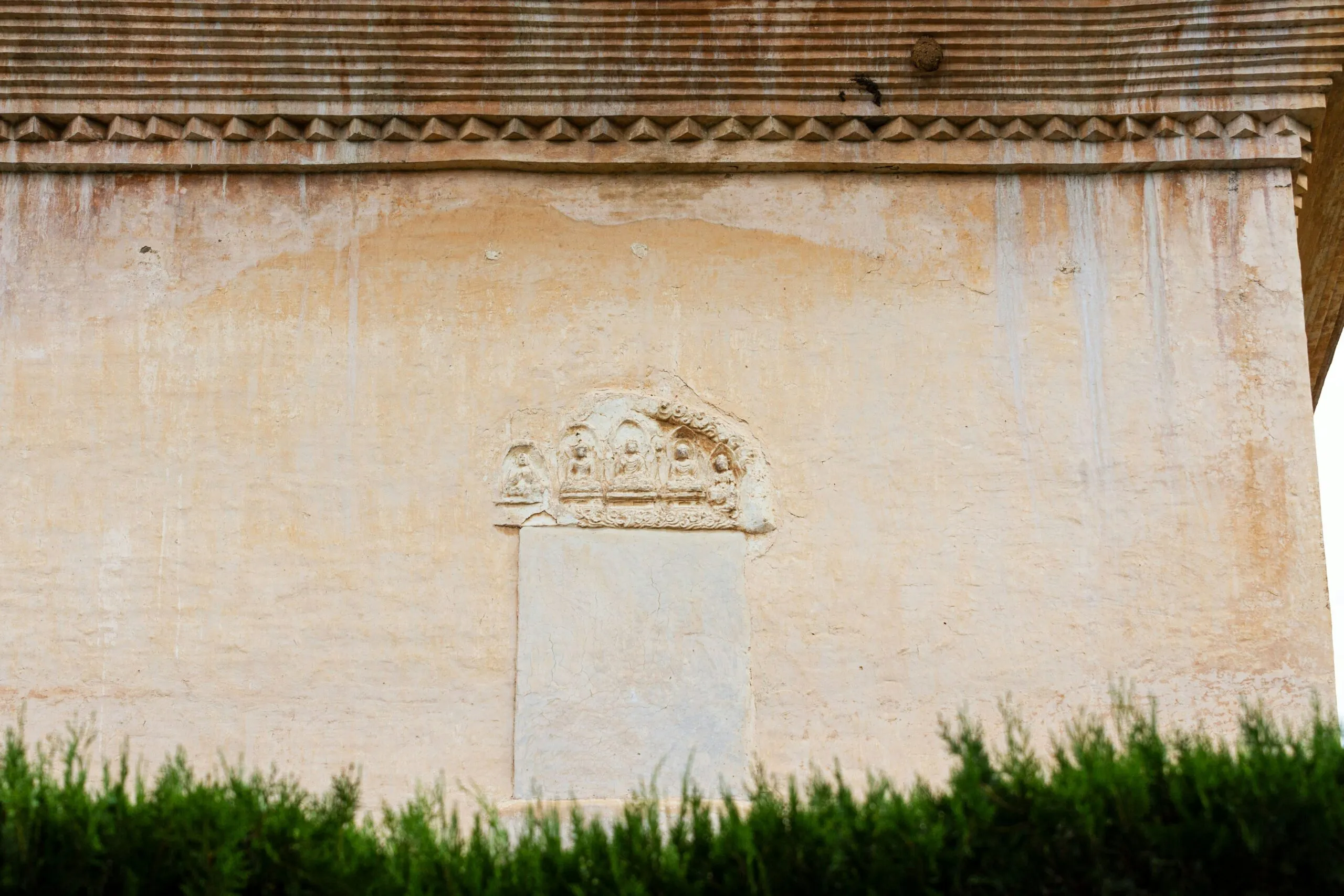 An old building with a clock on the side of it