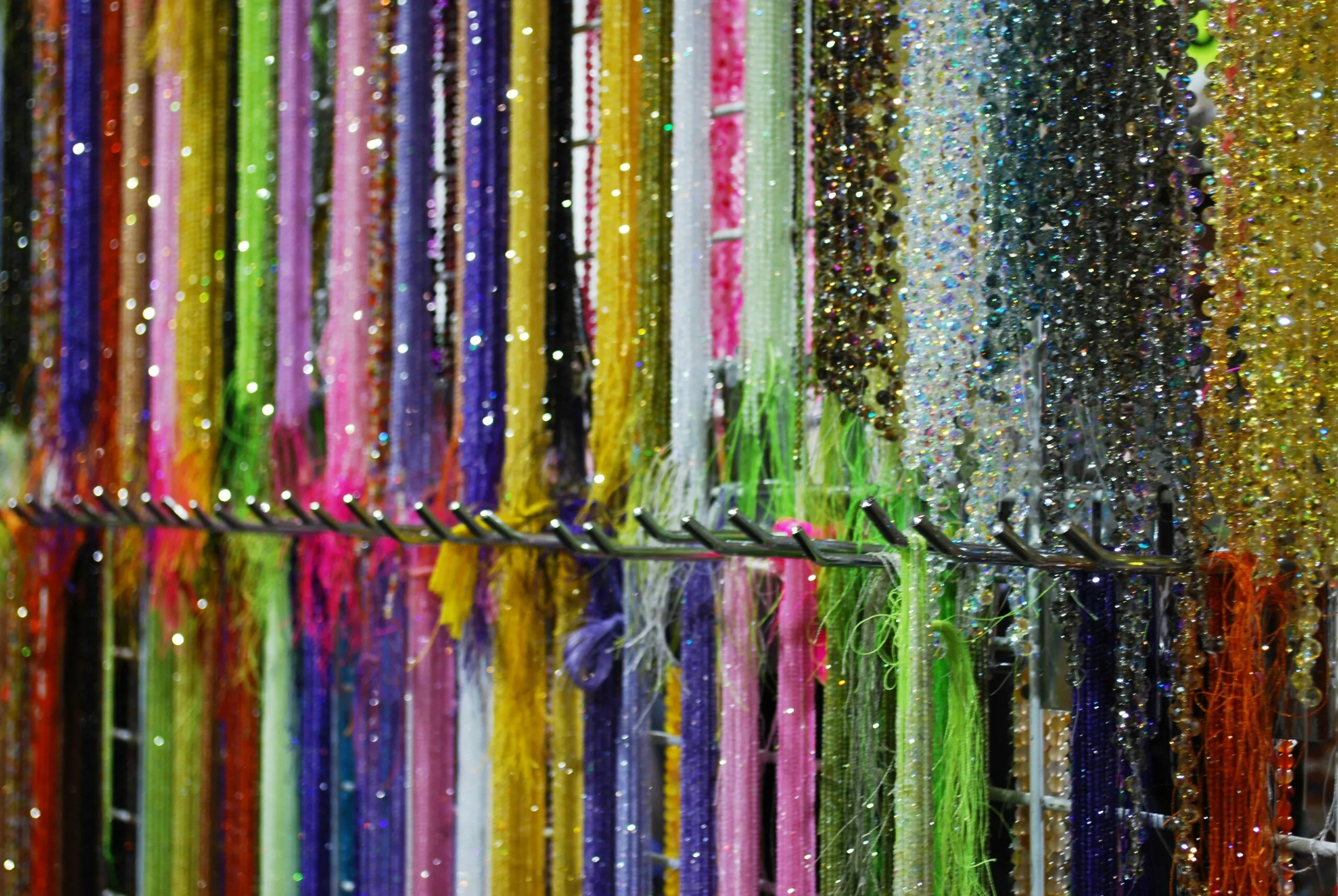A bunch of different colored streamers hanging on a wall