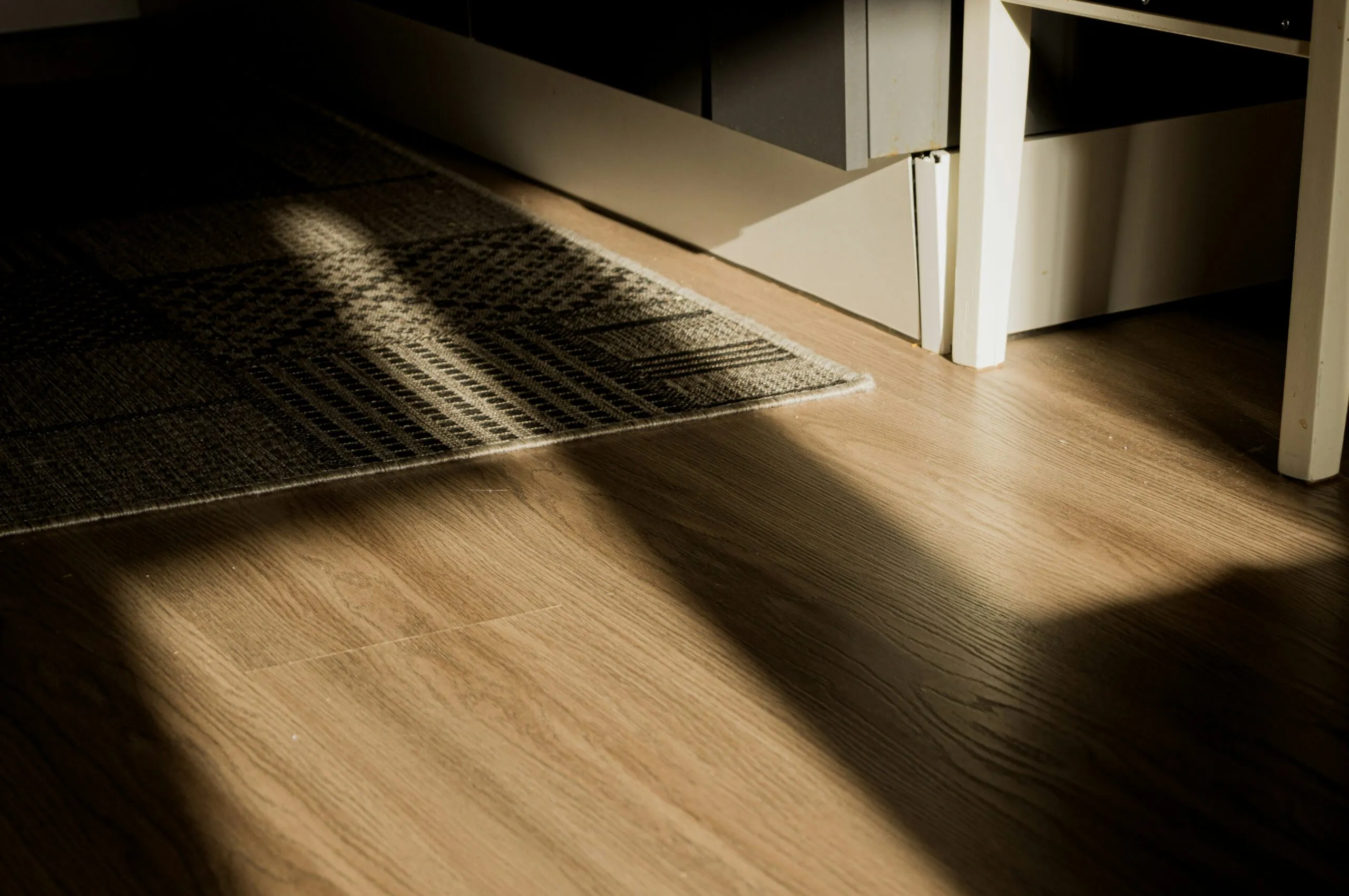 a wooden floor with a rug on it