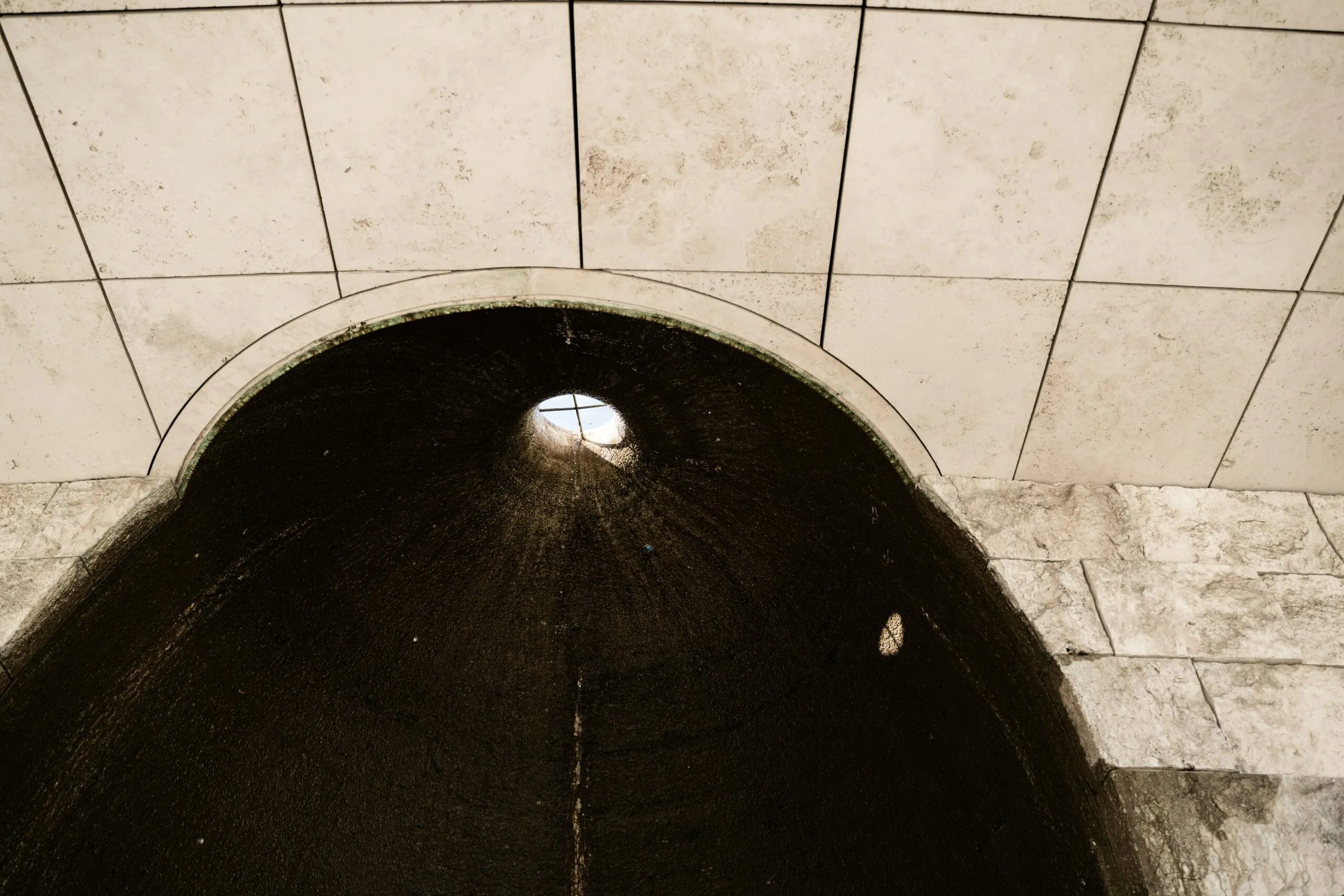 a black tunnel with a light