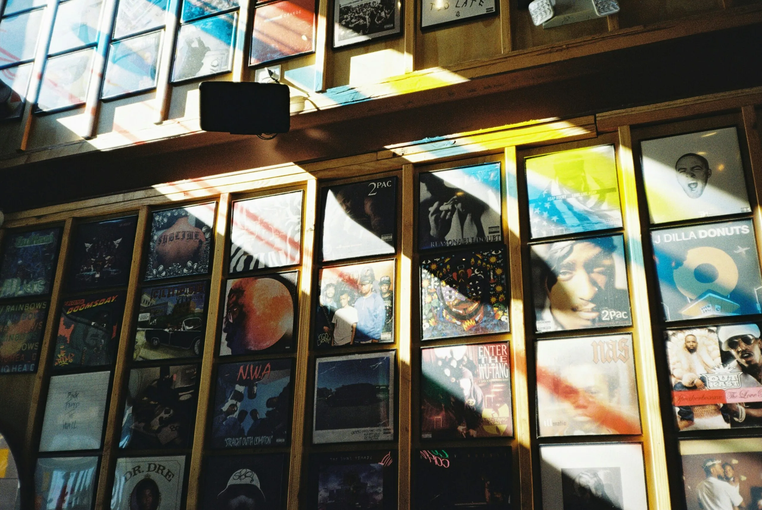 a room with a lot of windows and pictures on the wall