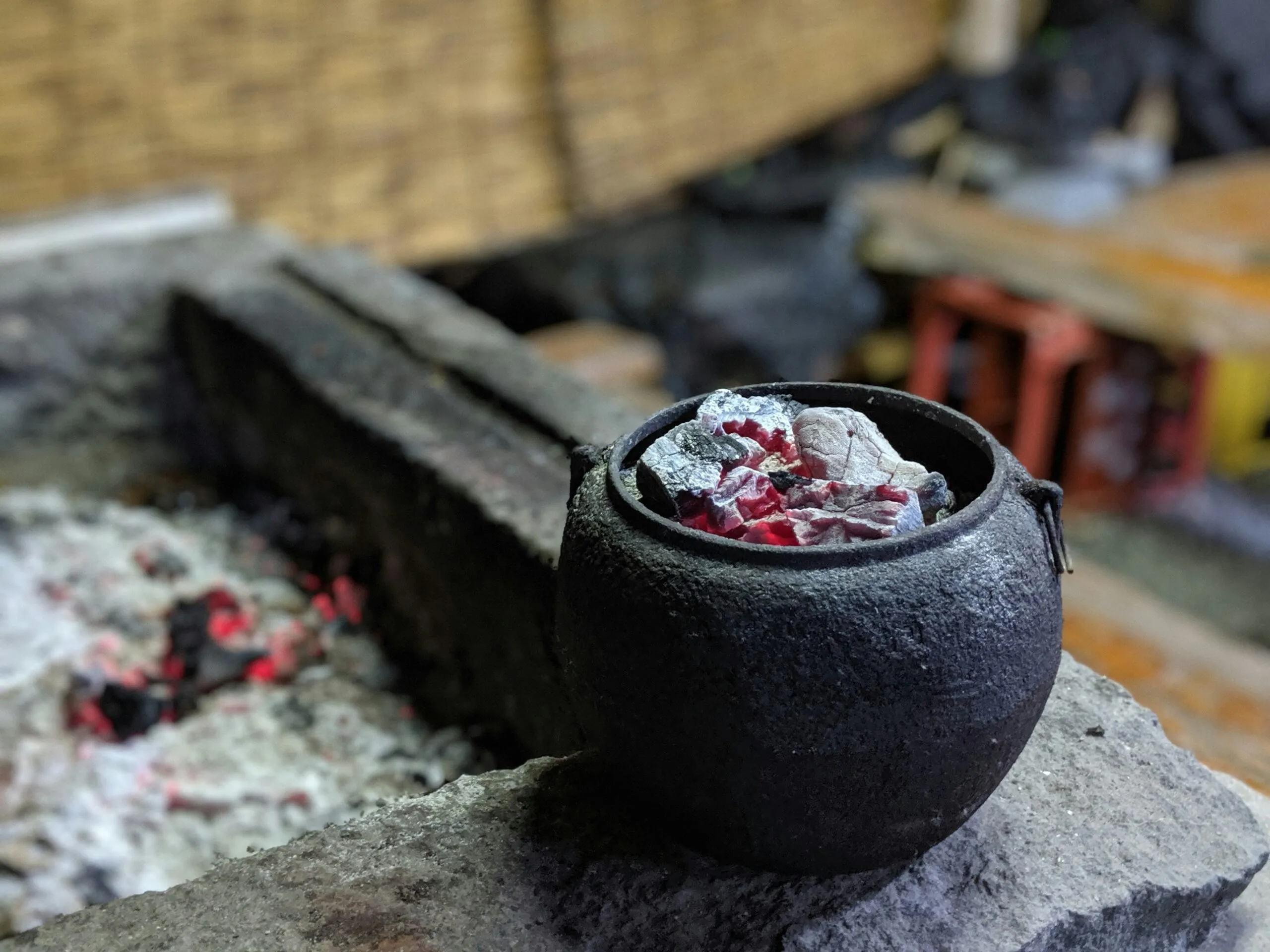 black ceramic round bowl on gray concrete surface