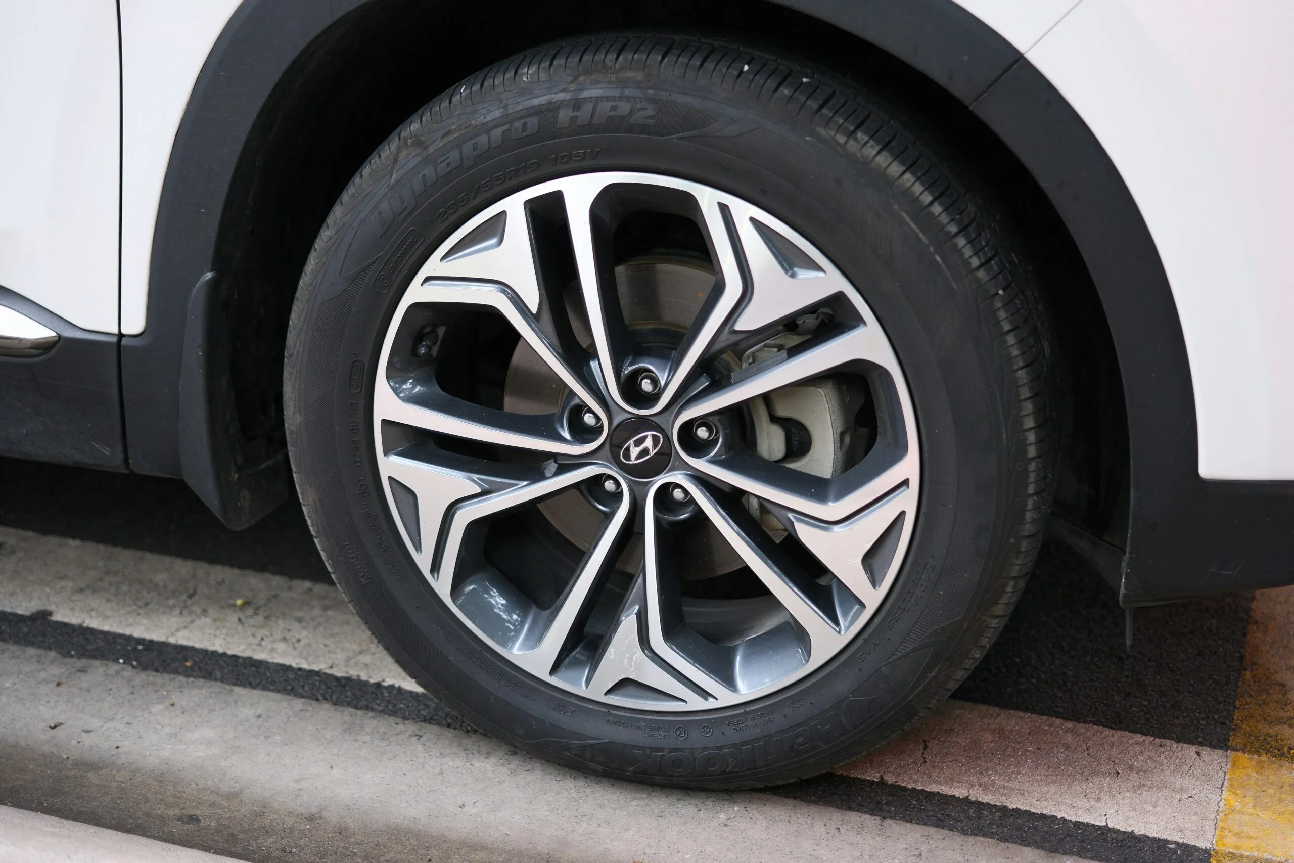 A car's wheel with stylish rims.