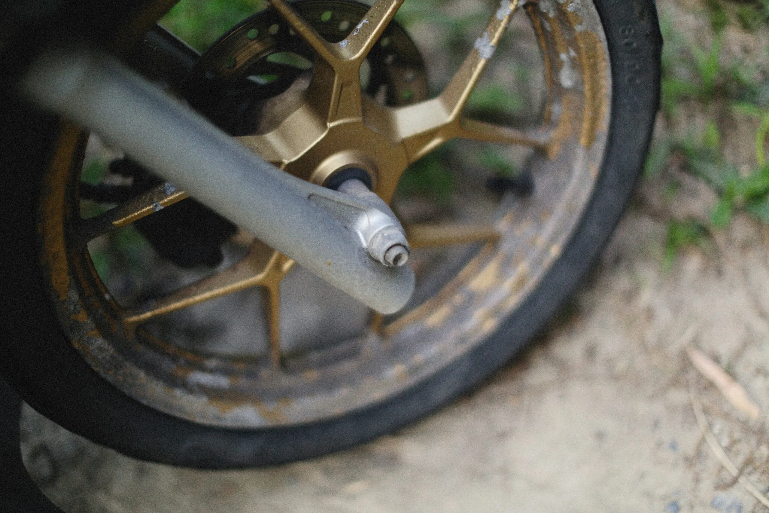 a close up of a motorcycle tire with a chain