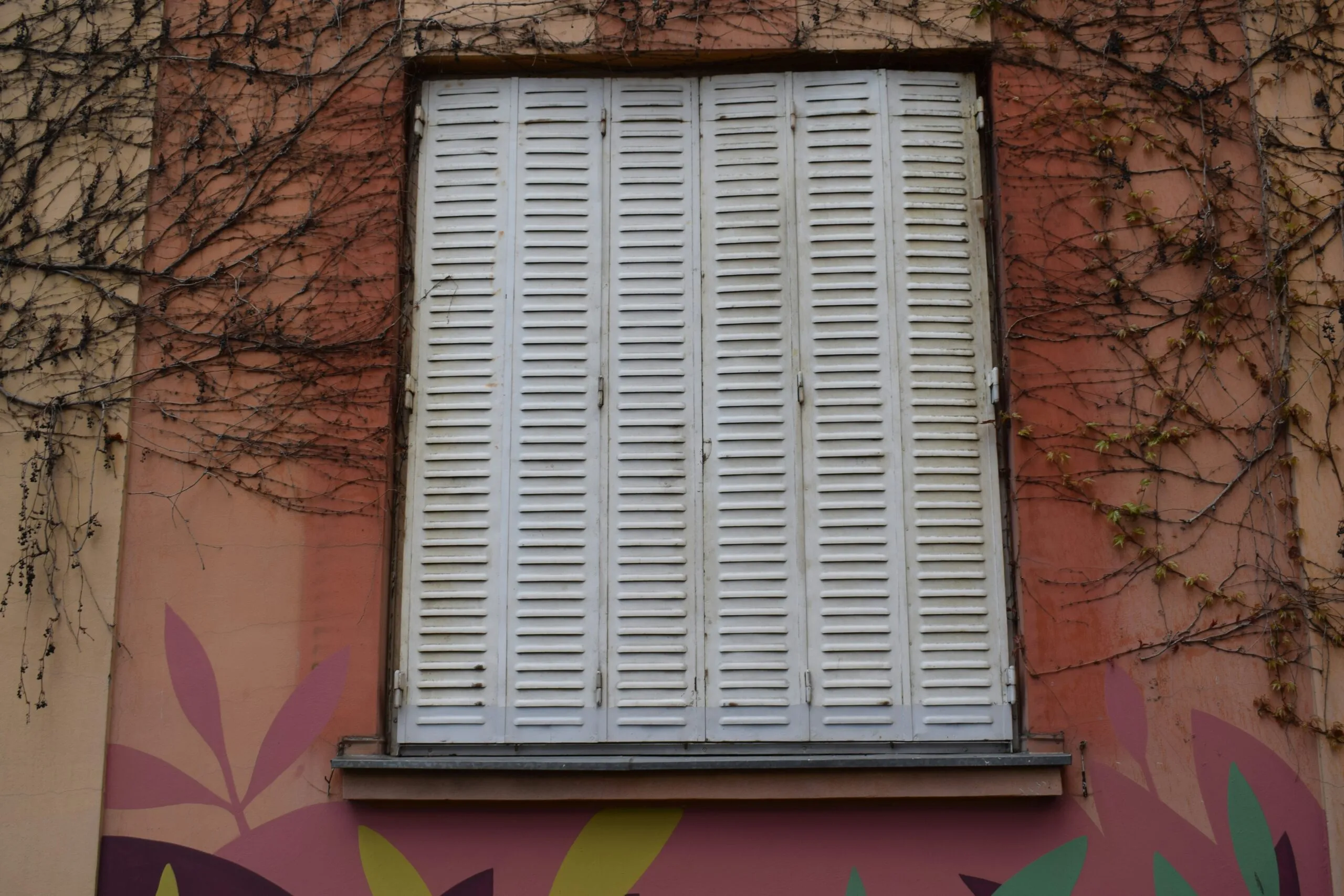 white wooden window frame on brown brick wall