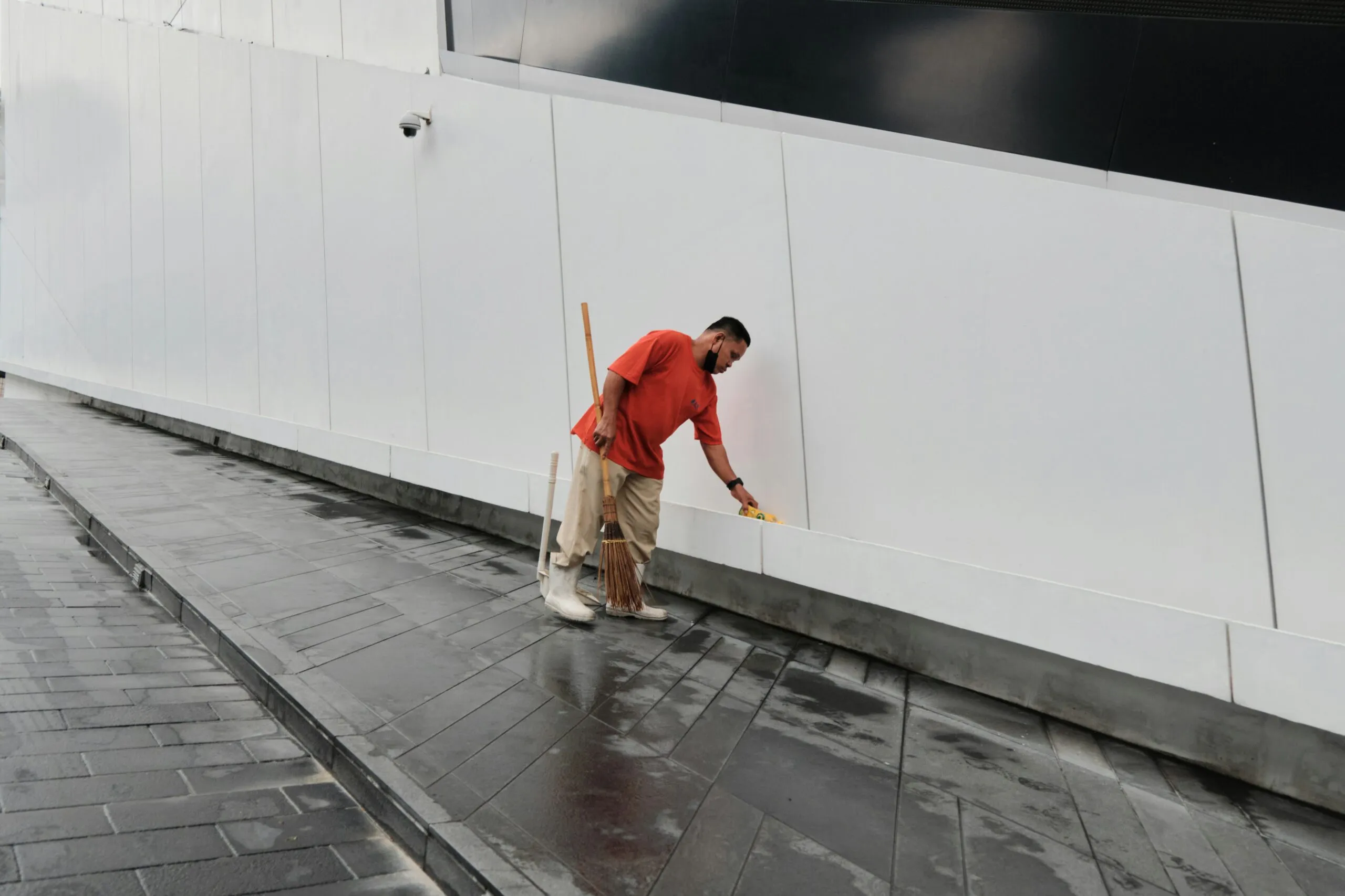 a man walking on a sidewalk