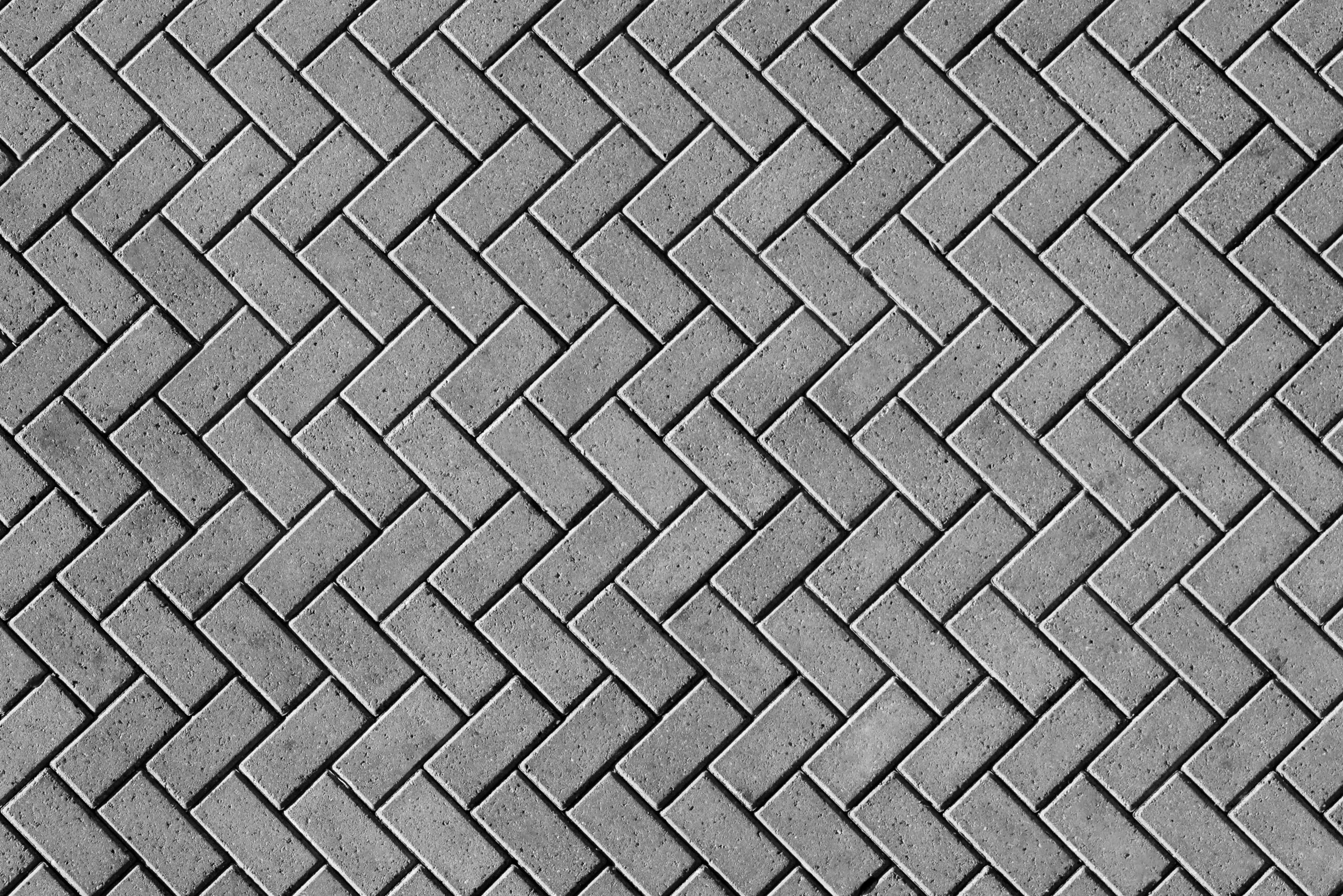 a black and white photo of a brick wall