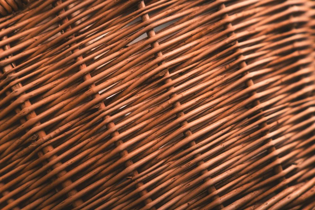 A close up of a brown wicker basket