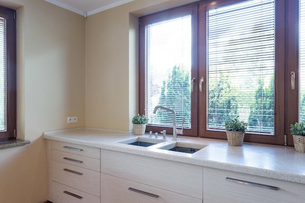 Kitchen with marble kitchentop with sink
