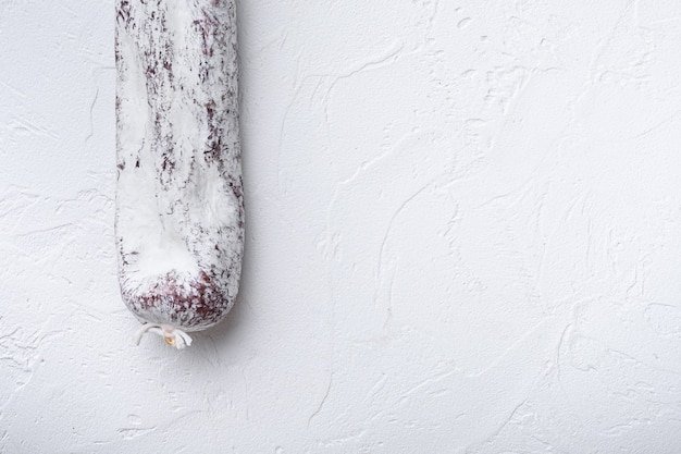 Longaniza spanish salami sausage on white with copy space