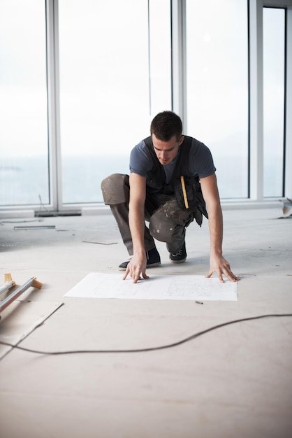 Man blueprint and architect with construction site planning and drawing for urban infrastructure Floor plan paperwork and illustration document for renovation property development or maintenance