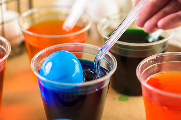 Painting Easter eggs with bright colors.