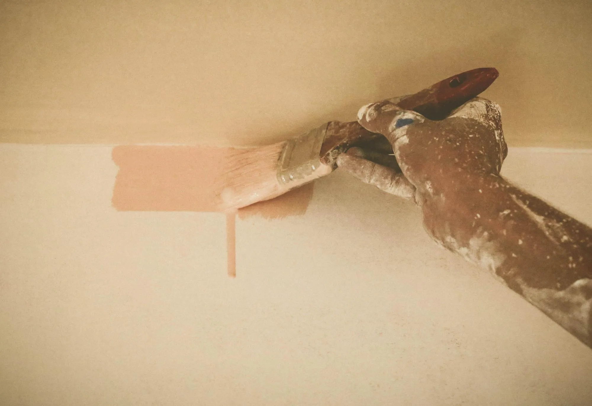Painting wall with brush depicted as old retro style