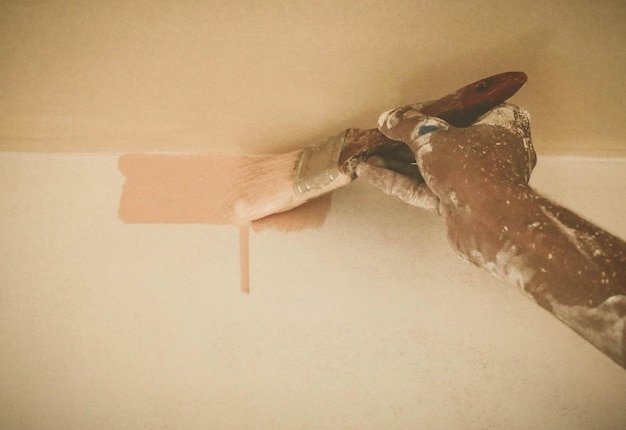 Painting wall with brush depicted as old retro style