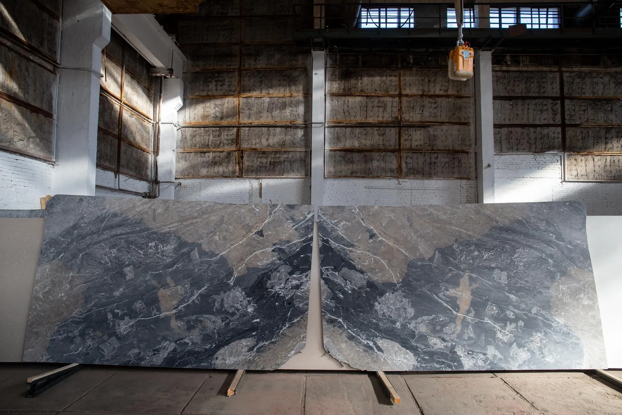 Photo of luxury grey marble slabs in warehouse mirrorlike French marble Breche de Aubisque