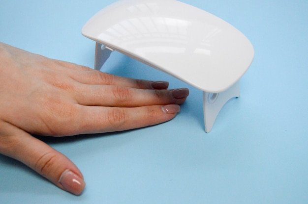 The process of making a beautiful manicure on the hands on the fingers