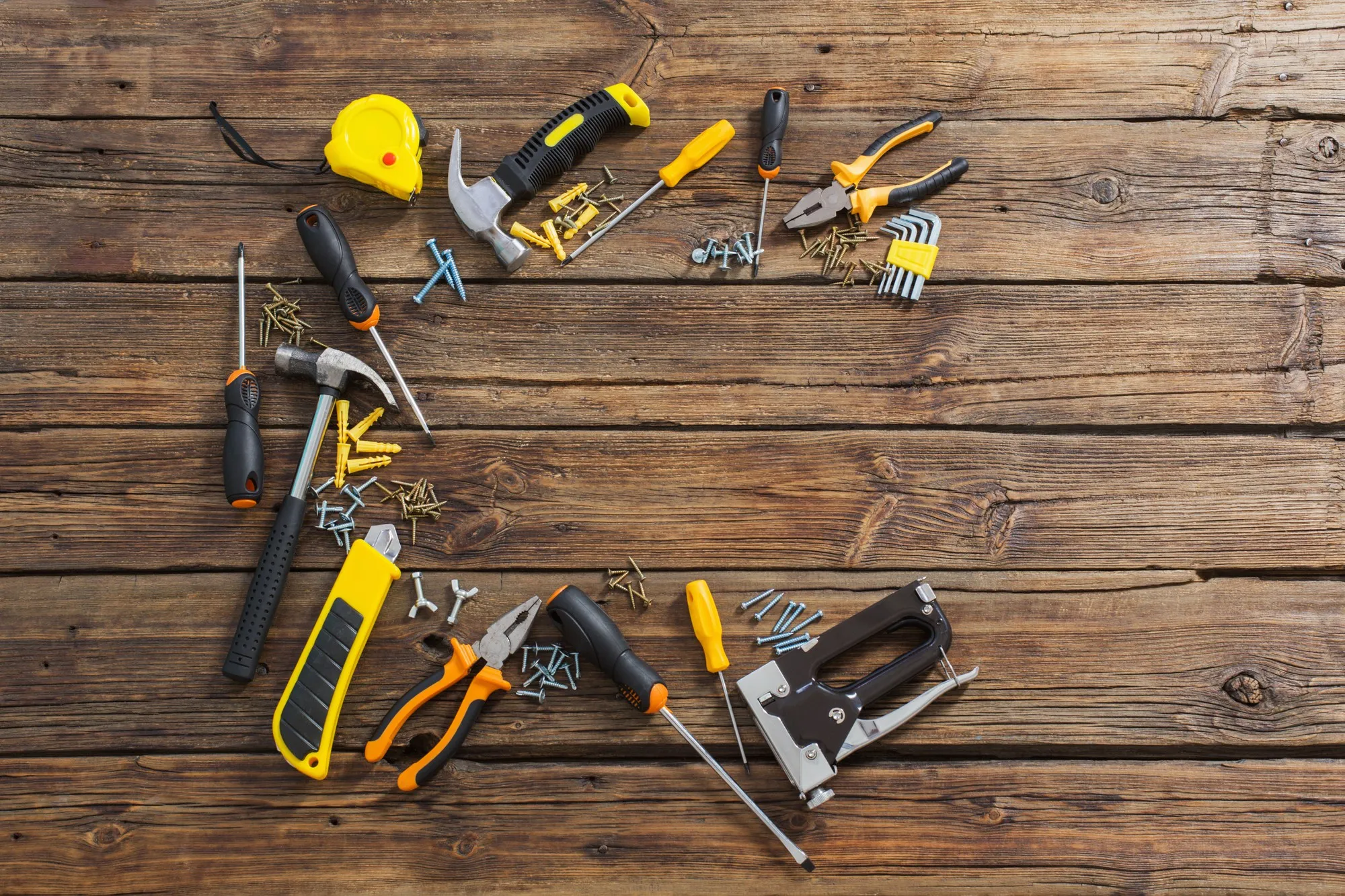 Set of repair tools on old wooden background
