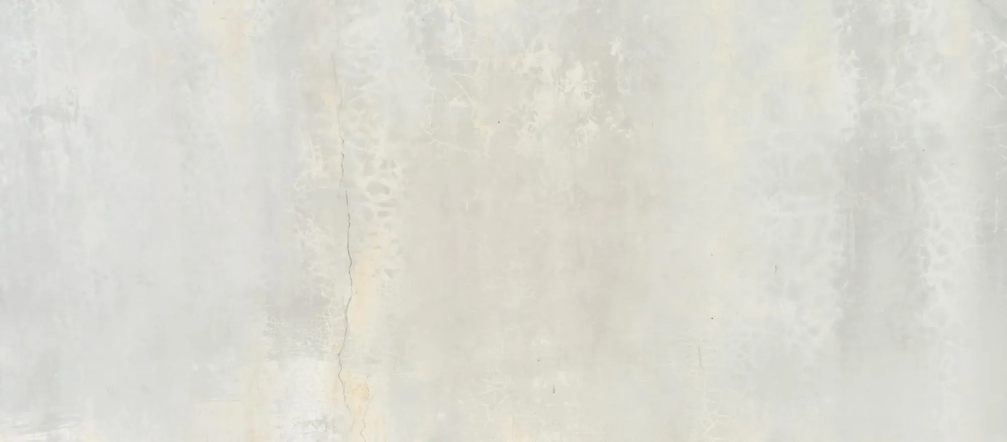 a wall with a textured background and a sign that says the word
