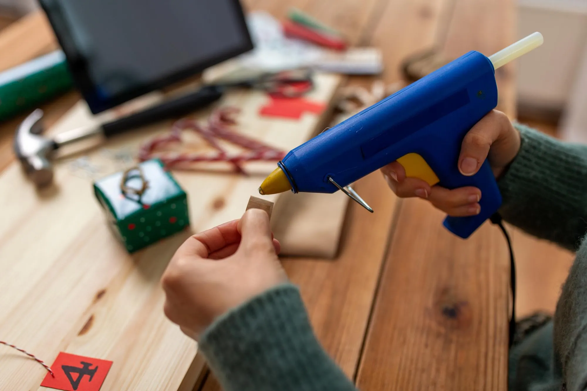 woman making advent calendar on christmas at home