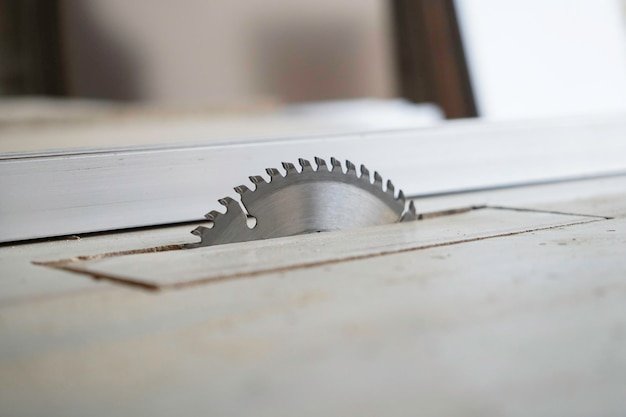 Wood cutter machine metal saw blade machine photograph of cutting wood by carpenter in workshop