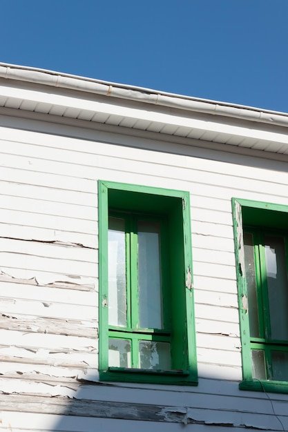 Wooden window with grille of wooden house