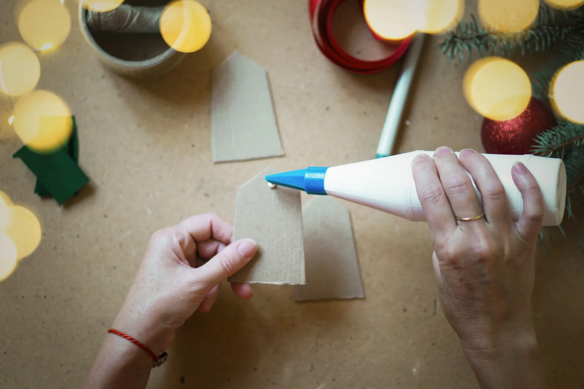 Christmas advent calendar with gifts for children. DIY instruction, step by step. Selective focus, warm vintage toning.