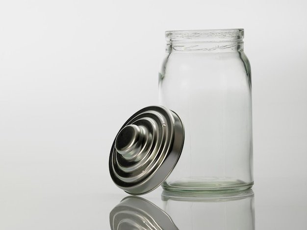 Close-up of empty glass bottle against white background