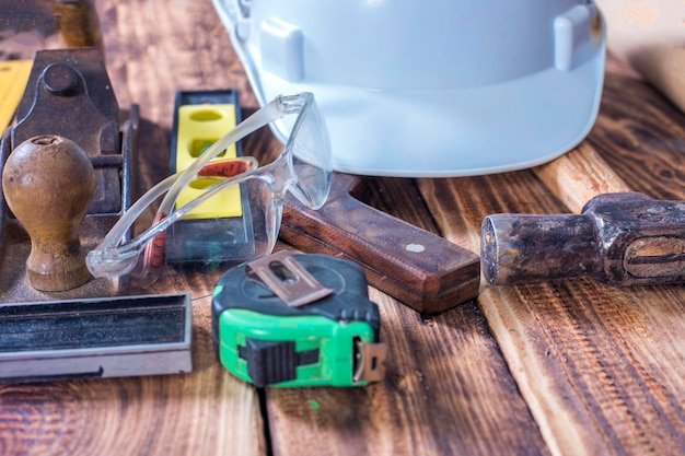 Collection of woodworking tools on a wooden background