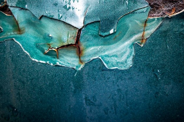 Corrosion on exterior part of an old rusty green car
