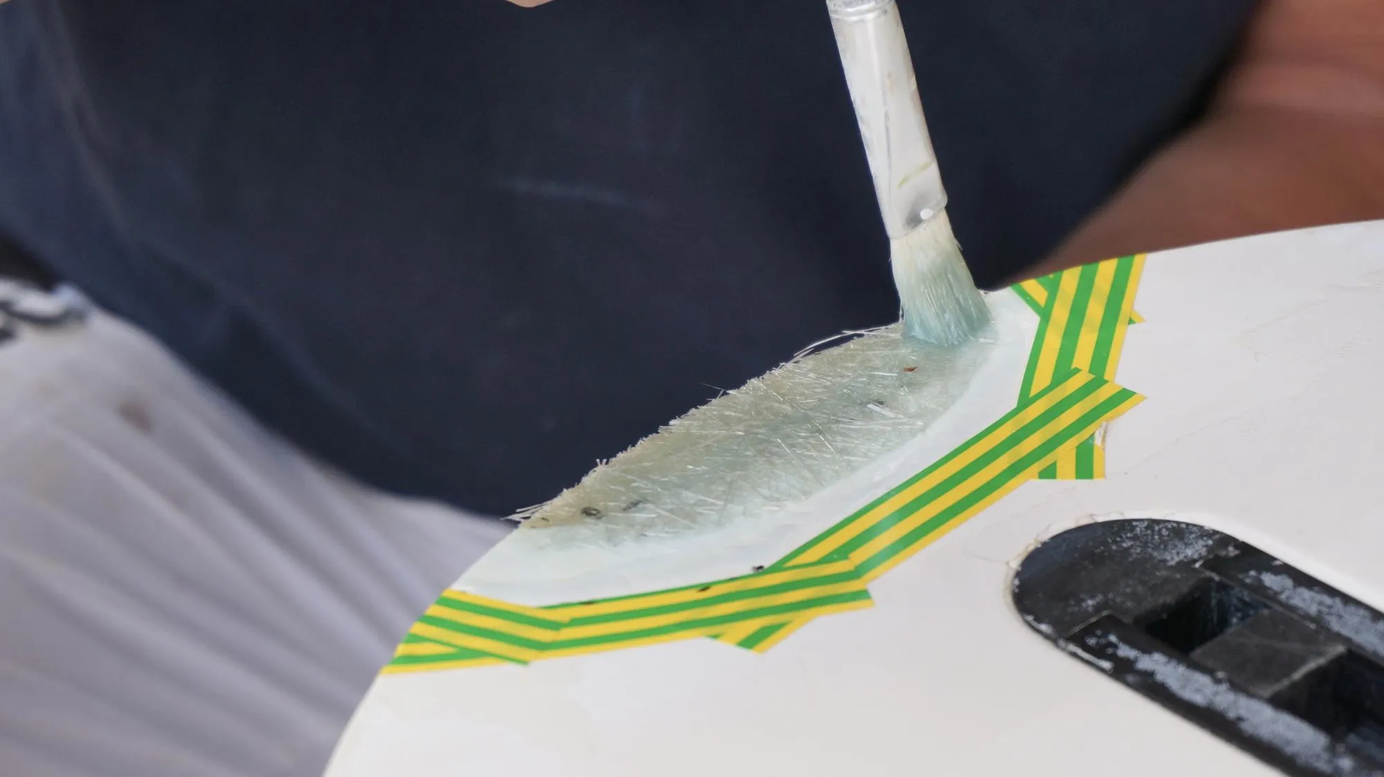 Covering surf board with white gel coat windsurfing board repair process