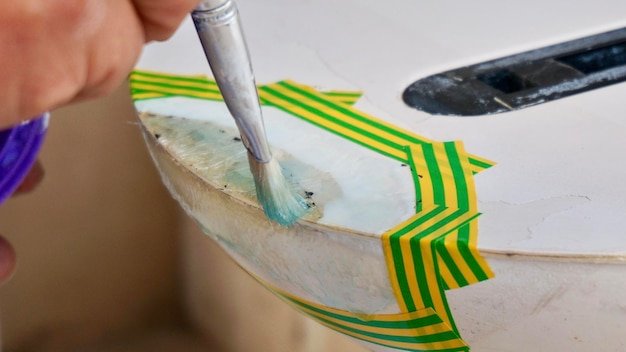 Covering surf board with white gel coat windsurfing board repair process
