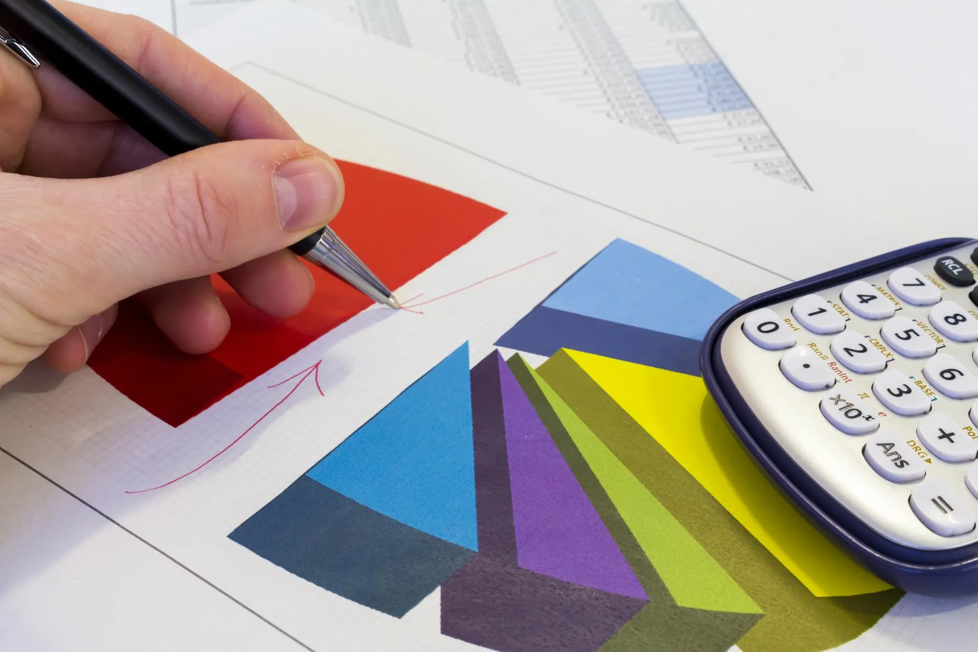 Cropped image of business person analyzing data on paper in office