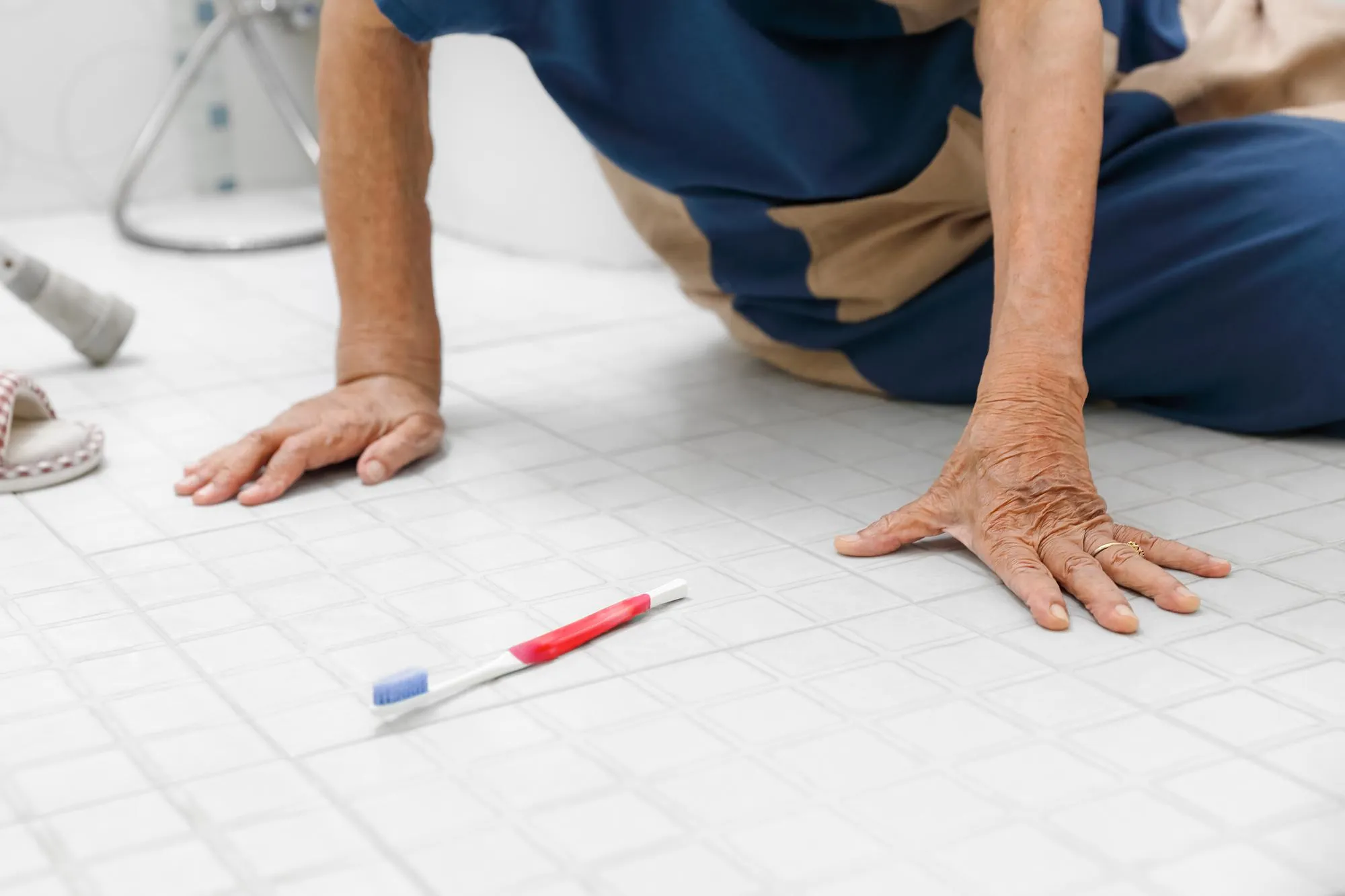 Elderly woman falling in bathroom because slippery surfaces