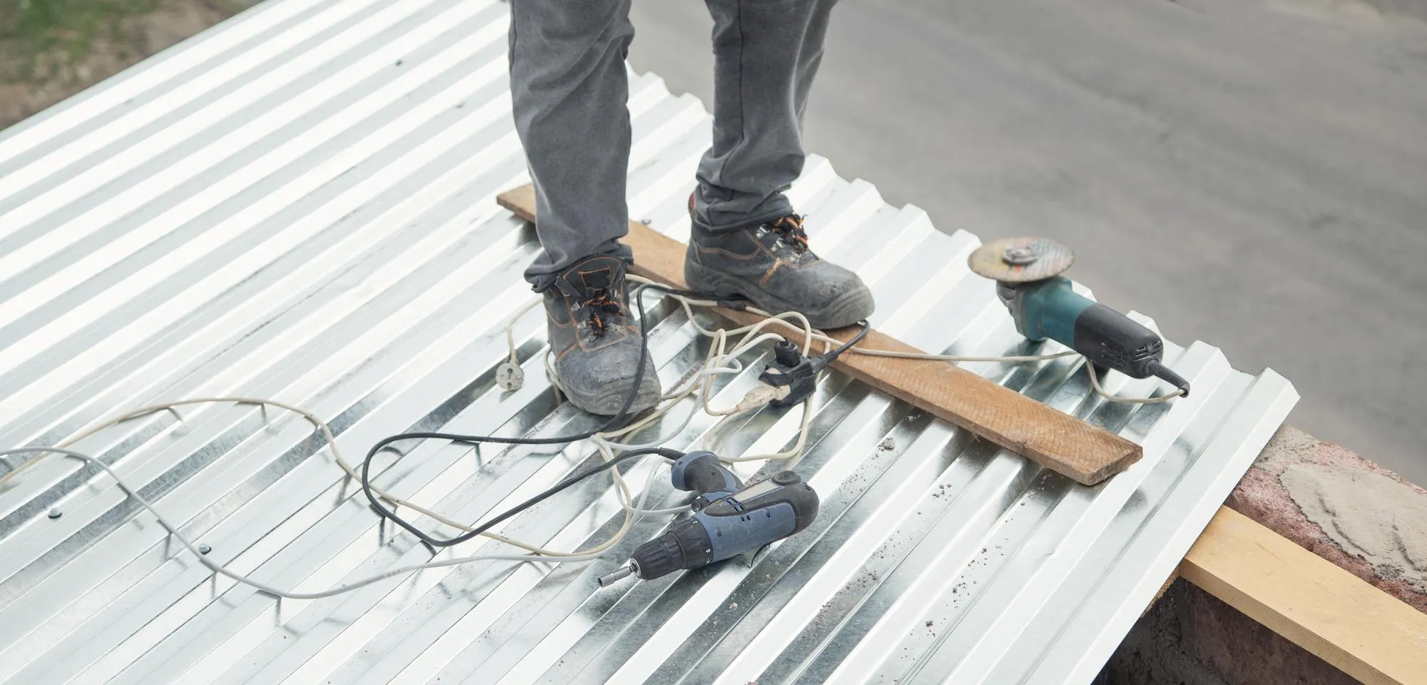 Electric tools Installation of sheets of metal tiles of roof