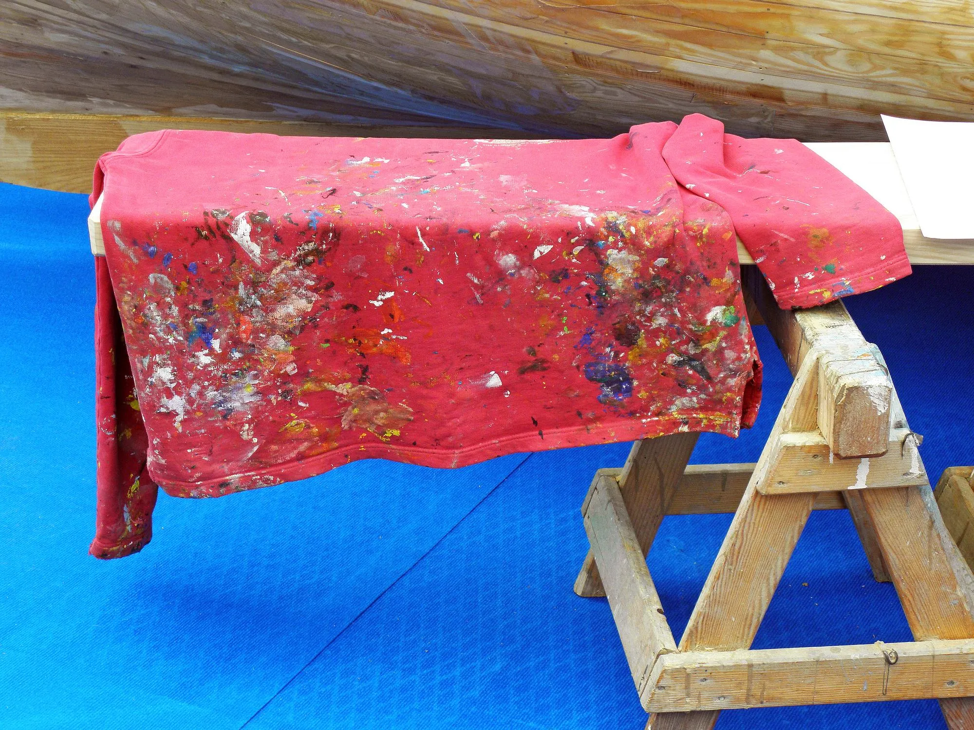 High angle view of dirty fabric on bench at workshop